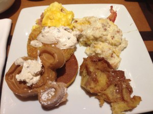 Ham and cheddar eggs; cheesy bacon grits; multigrain Mickey waffles and sweet potato pancakes with whipped cinnamon-pecan butter; bread pudding. (!)