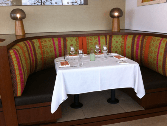 The banquette upholstery evokes the color and whimsy of Blair's work.